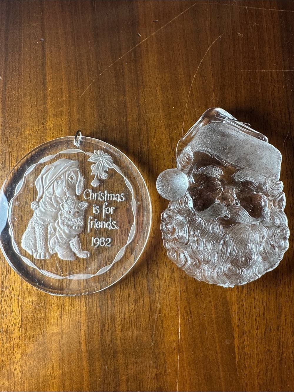 Two vintage 80s clear plastic ornaments 
Hallmark & Santa Face